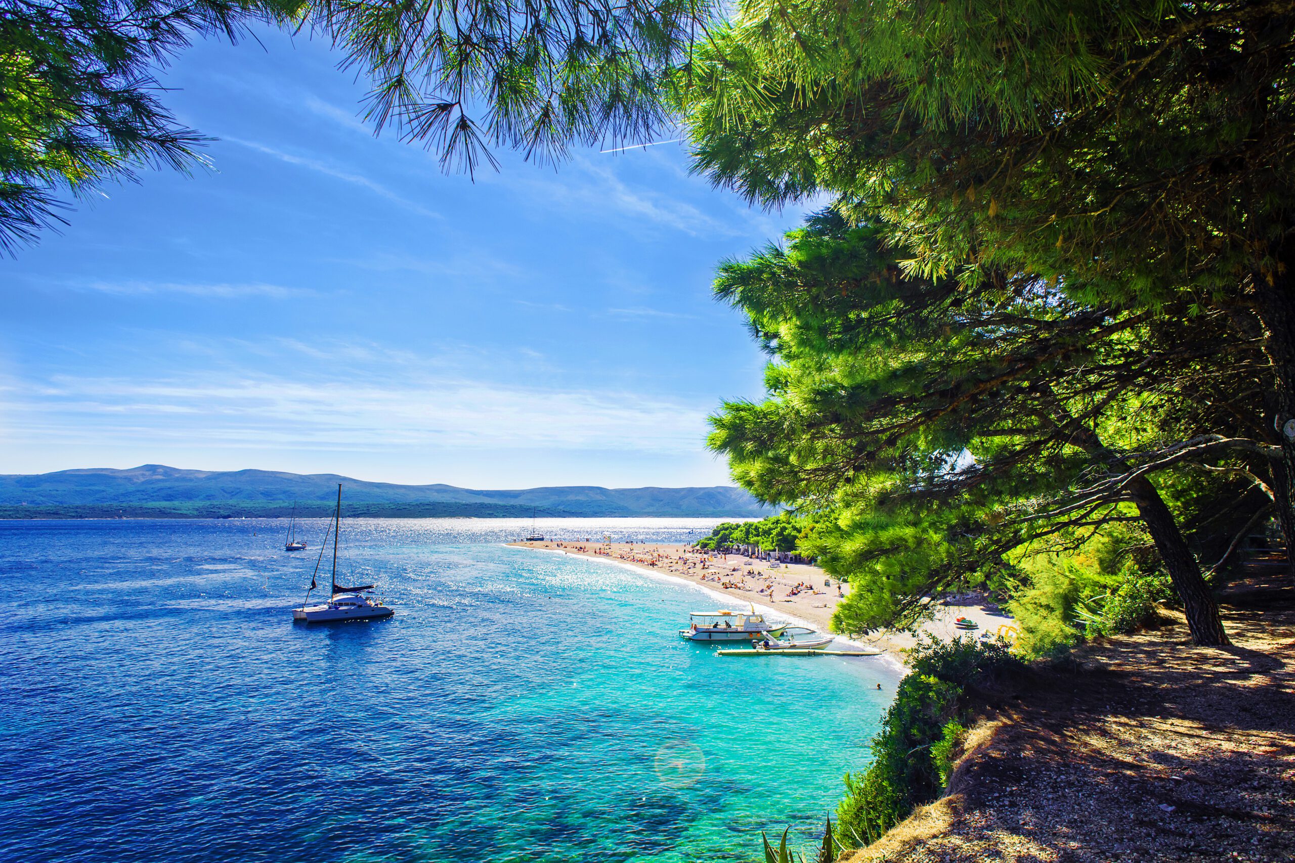 Beautiful Beach Zlatni Rat or Golden Cape on Island Brac in Croatia With Yacht